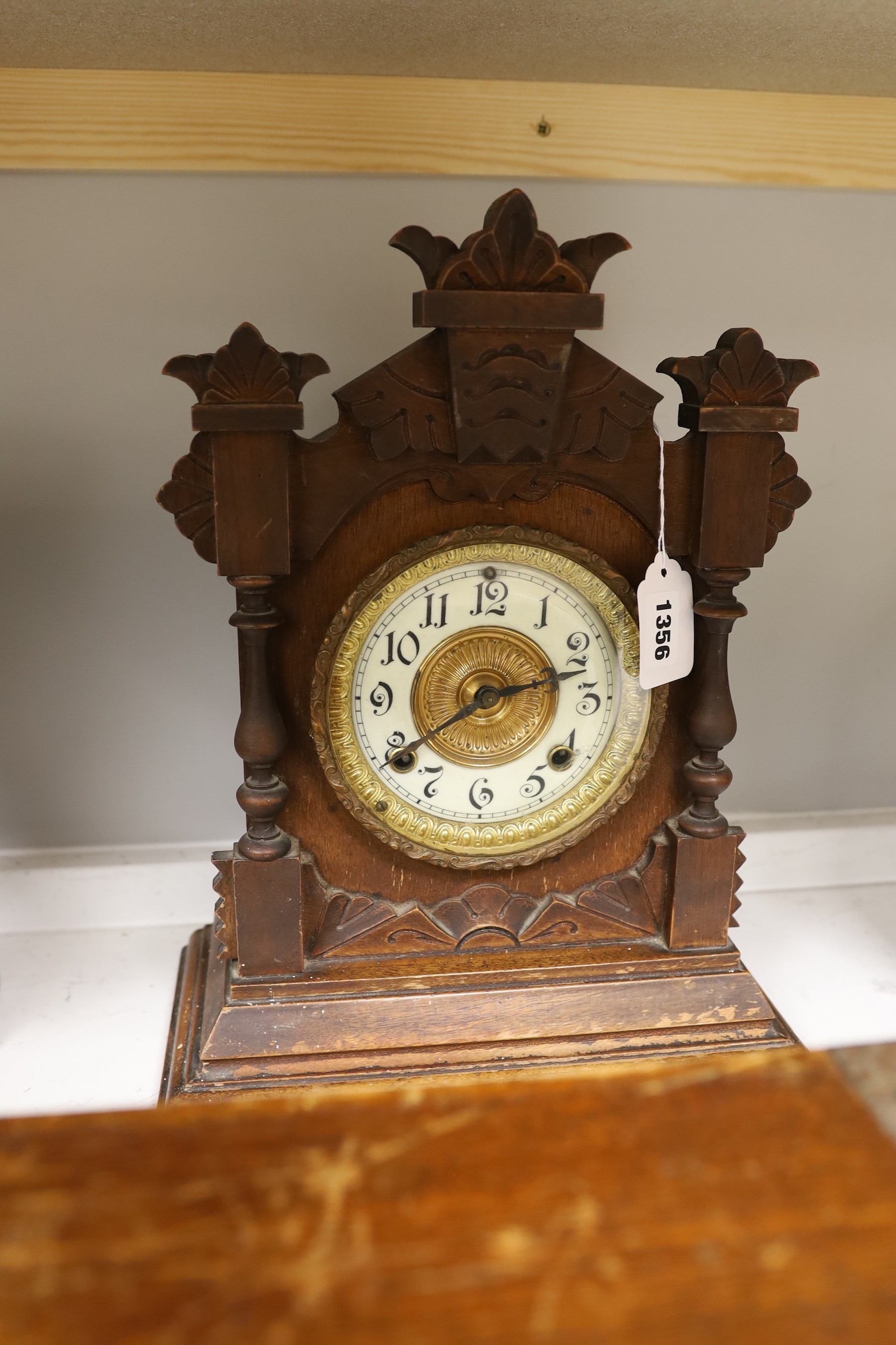 A brassbound box, a writing slope, a mantle clock, 37.5cm tall, and a bust of Nefertiti
